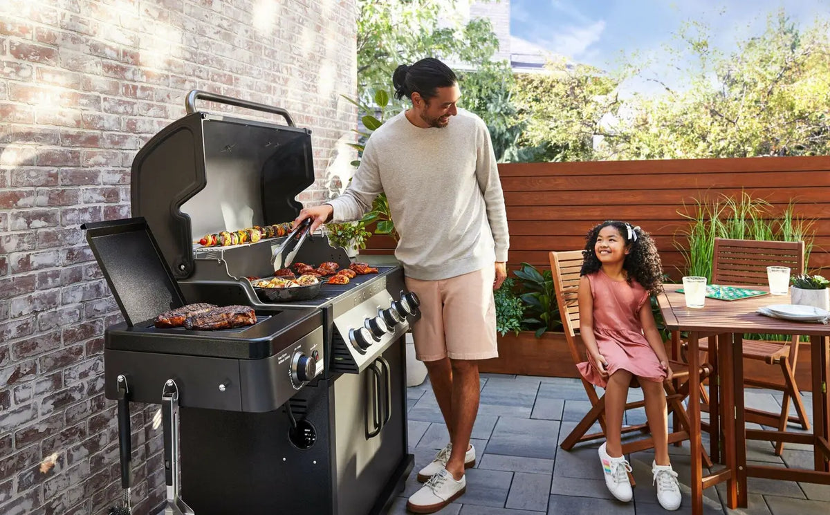 Coleman Pro Series built in bbq, angled view showing the cabinet-mount side panel