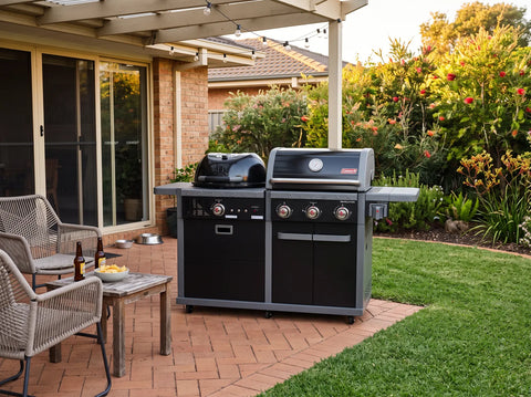 Coleman Revolution dual fuel gas and charcoal BBQ set up on a backyard entertaining area
