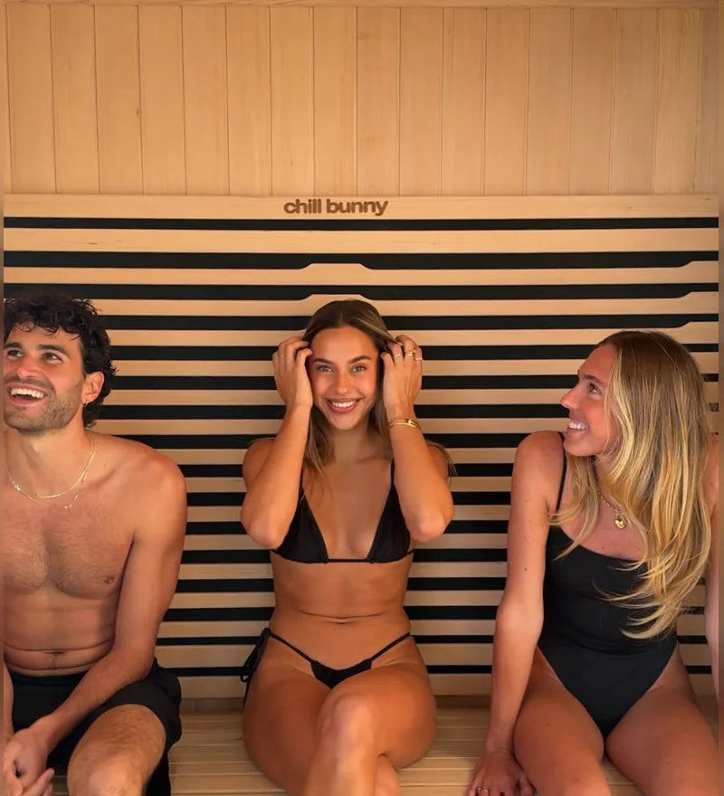 Three friends sitting in a Chill Bunny infrared sauna