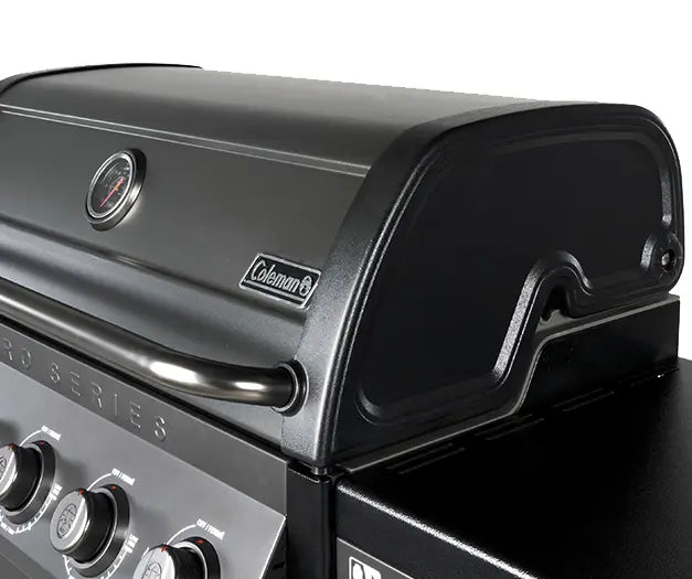 Coleman Pro Series bbq lid detail showing the temperature gauge and Coleman branding