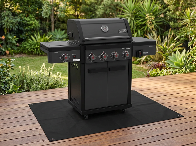 Obsidian protector mat under a Coleman Revolution 4 Burner gas BBQ on a timber deck